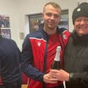 Spartans man of the match Kevin Waugh receives the bubbly from Chris Wilder. Picture: Mark Brown.