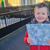 Seven-year-old Ryan Black is delighted with his Secret Santa present.