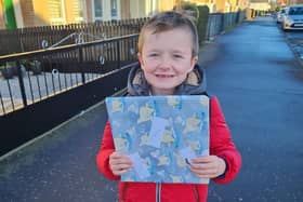 Seven-year-old Ryan Black is delighted with his Secret Santa present.