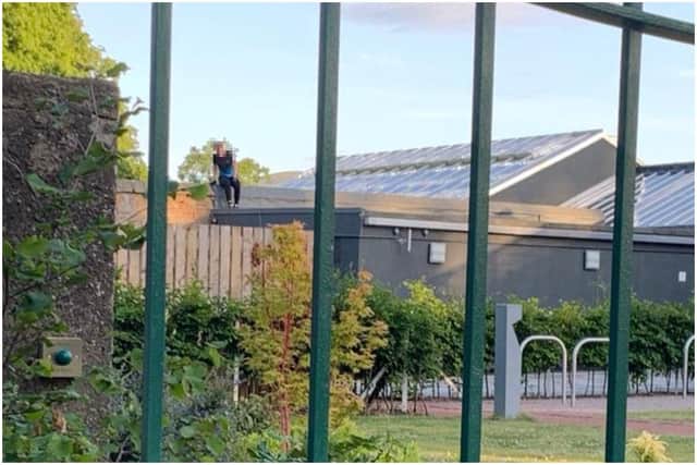 Teenager spotted on the roof of a greenhouse in Saughton Park