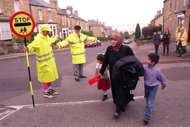 The Lord Mayor of Sheffield Coun Frank Wright gets the message across at the launch of the Stop! campaign, as he assists lollipop lady Stella Harrison at the junction of Western Road and Springvale Road in 1998