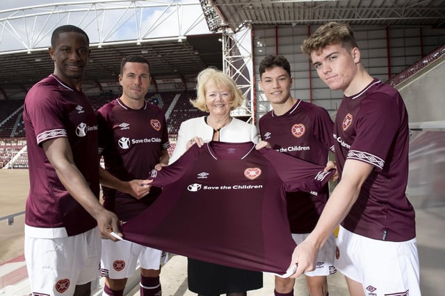 Modelled by, from left to right, Arnaud Djoum, Don Cowie,  Ann Budge, Anthony McDonald and Euan Henderson. You can also see evidence in the background of the Tynecastle pitch having been ripped up before a new hybrid surface was installed.
