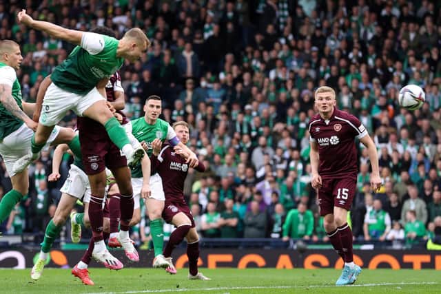 Hibs defender Ryan Porteous heads towards goal in the Scottish Cup semi-final earlier this year. His effort would be saved by his international team-mate, Hearts keeper Craig Gordon. Picture: SNS