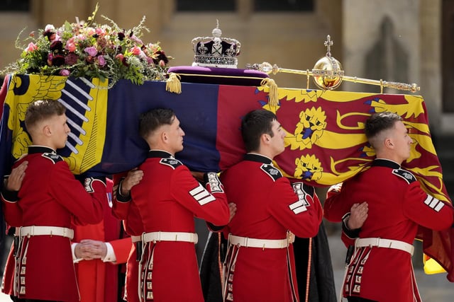 The coffin of Queen Elizabeth II with the Imperial State Crown resting on top is carried by the Bearer Party as it departs Westminster Abbey during the State Funeral  (Photo by Christopher Furlong/Getty Images)