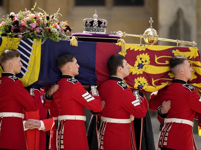 The coffin of Queen Elizabeth II with the Imperial State Crown resting on top is carried by the Bearer Party as it departs Westminster Abbey during the State Funeral (Photo by Christopher Furlong/Getty Images)