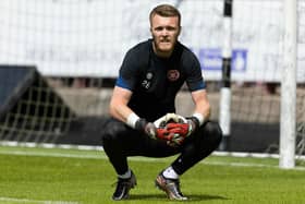 Hearts' Zander Clark is injured in the warm-up during a pre-season friendly match between Dunfermline and Hearts. Pic: SNS