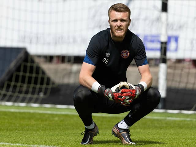 Hearts' Zander Clark is injured in the warm-up during a pre-season friendly match between Dunfermline and Hearts. Pic: SNS