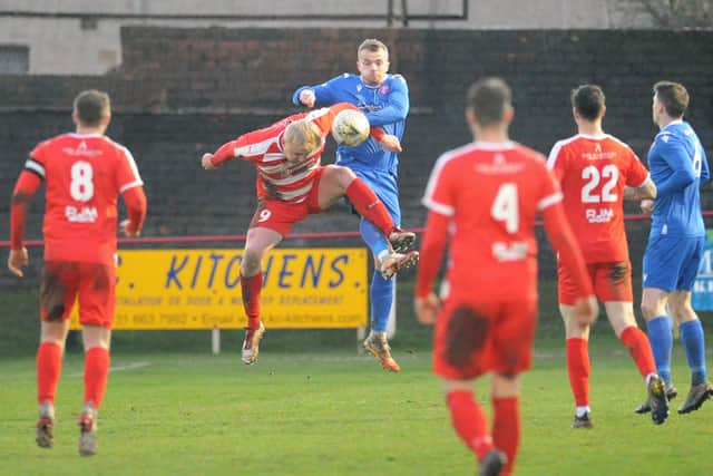 Bonnyrigg targetman Kieran McGachie, challenged here by Kevin Waugh, proved to be a handful for the Spartans defence