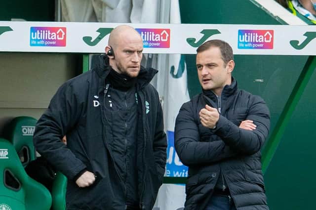 Shaun Maloney with first-team coach David Gray discusses tactics in the technical area