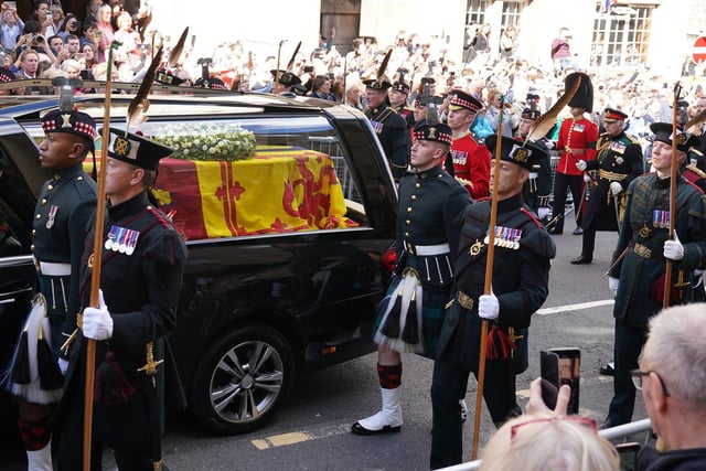 King Charles III and members of the royal family join the procession of Queen Elizabeth's coffin from the Palace of Holyroodhouse to St Giles' Cathedral, Edinburgh.Picture date: Monday September 12, 2022.