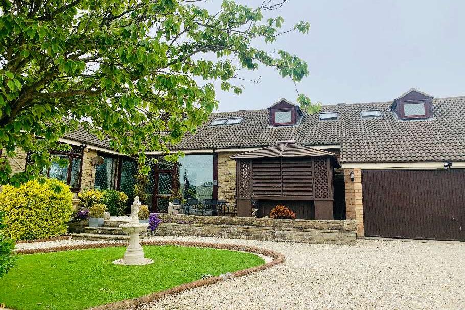 The property, accessed from St Michael's Lane, off Filey Road, boasts a large driveway and double garage.