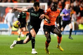 Joe Newell battles for possession with Dundee United's Sadat Anaku during Hibs' 1-0 loss at Tannadice earlier in the season. Picture: SNS