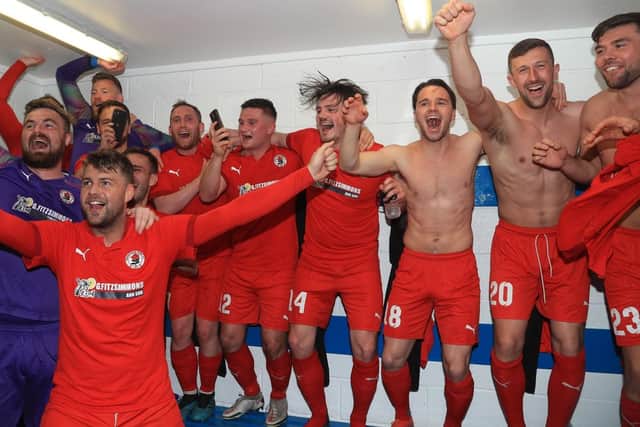 The Rose players celebrate in the dressing room. Picture: Joe Gilhooley  LRPS