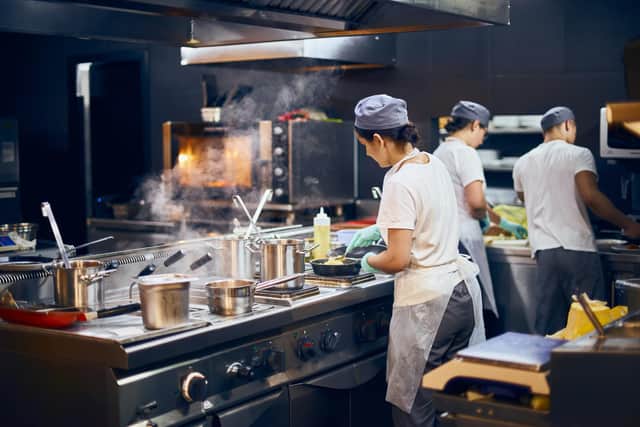 The heat of the kitchen, but staff say they are owed wages
