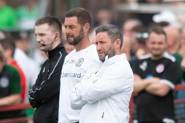 Hibs manager Lee Johnson and assistant boss Jamie McAllister watch on during the Bonnyrigg Rose clash