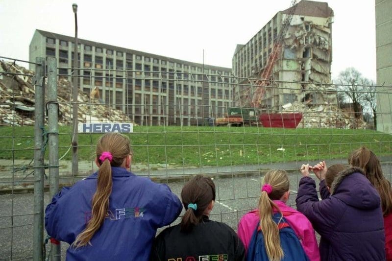 Children can be seen here watching the old Westburn blocks of flats being torn down at Wester Hailes, Edinburgh. This picture was taken in January, 1993.