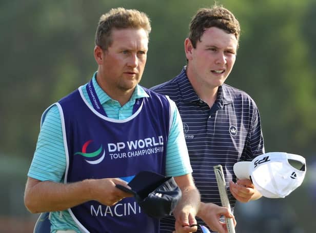 Bob MacIntyre with caddie Mike Thomson after finishing his opening round in the DP World Tour Championship at Jumeirah Golf Estates in Dubai. Picture: Andrew Redington/Getty Images.