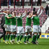 Hibs players celebrate in front of the away fans at full-time of the Boxing Day victory over Hearts at Tynecastle.