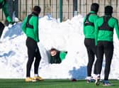 Martin Boyle carries out an in-depth pitch inspection of his own at Hibs' East Mains training complex