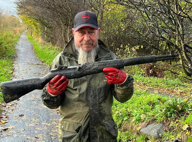 John Robertson was out fishing with friends when he caught hold of a semi-automatic M1 Garand assault weapon