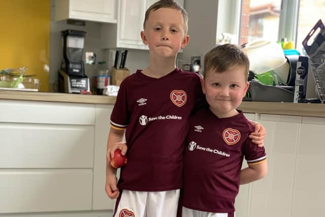Logan (right) with his brother Lewis. The pair will take to the Tynecastle Park pitch next Sunday as mascots for the match against Celtic, along with Logan's twin brother Jude.