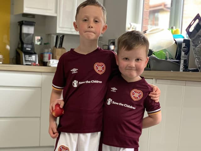 Logan (right) with his brother Lewis. The pair will take to the Tynecastle Park pitch next Sunday as mascots for the match against Celtic, along with Logan's twin brother Jude.