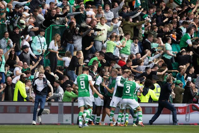 Hibs players and fans celebrate Martin Boyle's equaliser against Hearts in Sunday's Edinburgh derby. Picture: SNS