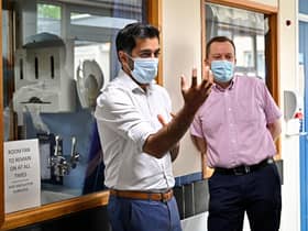 Scotland's clinical director Jason Leitch, right, seen with Health Secretary Humza Yousaf, is right that Covid is not over (Picture: Jeff J Mitchell/pool/AFP via Getty Images)