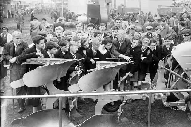 Royal High School boys watch a reversible plough demonstration at the Royal Highland Show at Ingliston in June 1963.