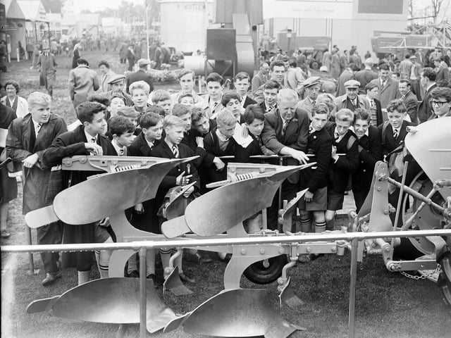 Royal High School boys watch a reversible plough demonstration at the Royal Highland Show at Ingliston in June 1963.