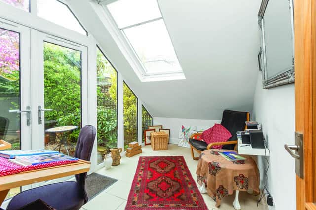 Sun room overlooking the flat’s green space. Image: Philip Stewart