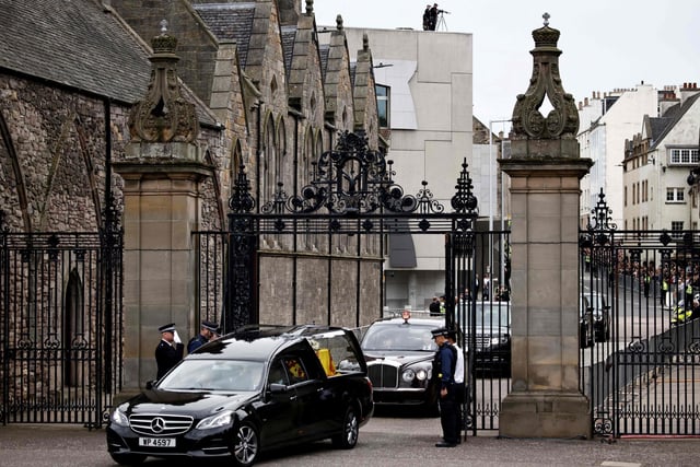 The hearse carrying the coffin of the late Queen Elizabeth II arrives at the Palace of Holyroodhouse in Edinburgh