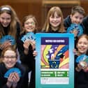 Pupils at Flora Stevenson Primary School have a first shot at playing the COP26 Top Trumps game which they helped to design
