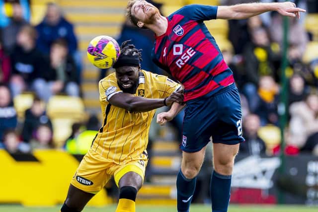 Livingston's Ayo Obileye and Ross County's Jordan White challenge for the ball at the Tony Macaroni Arena. Picture: Roddy Scott / SNS