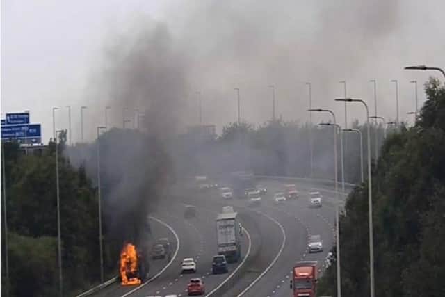 The First Glasgow bus on fire on the M74 on Monday. Picture: Traffic Scotland