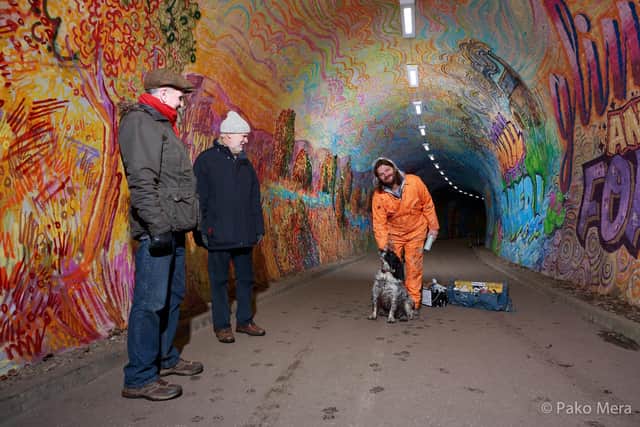 Chris, a furry friend and some trustee's in the transformed tunnel