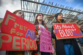 Campaigners demonstrate outside the Scottish Parliament in support of the Period Products Bill. (Picture: Jeff J Mitchell/Getty Images)