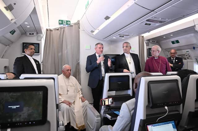 Archbishop of Canterbury Justin Welby (second from right), Pope Francis (second from left) and Church of Scotland's Iain Greenshields (third from right) address the media while aboard a plane returning from their visit to Democratic Republic of Congo and South Sudan (Picture: Tiziana Fabi/pool/AFP via Getty Images)