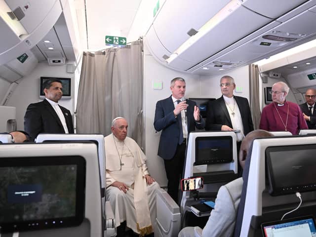 Archbishop of Canterbury Justin Welby (second from right), Pope Francis (second from left) and Church of Scotland's Iain Greenshields (third from right) address the media while aboard a plane returning from their visit to Democratic Republic of Congo and South Sudan (Picture: Tiziana Fabi/pool/AFP via Getty Images)