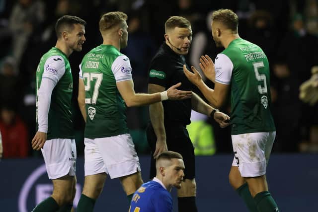 Ryan Porteous protests the award of a penalty given by referee John Beaton after Ryan Kent hits the deck