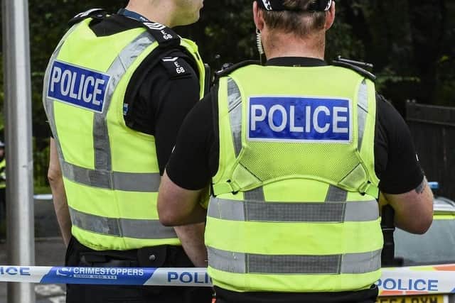 Police in West Lothian are looking for two suspects who broke into and robbed a business premises in Livingston.