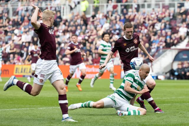 Celtic's Daizen Maeda goes down following a foul from Hearts' Alex Cochrane, who is sent off following a VAR check