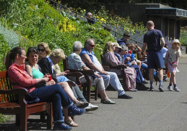 PIC LISA FERGUSON 29/05/2023Temperatures reach over 20 degrees this afternon in Edinburgh City CentrePeople enjoy the hot weather in Princes Street Gardens