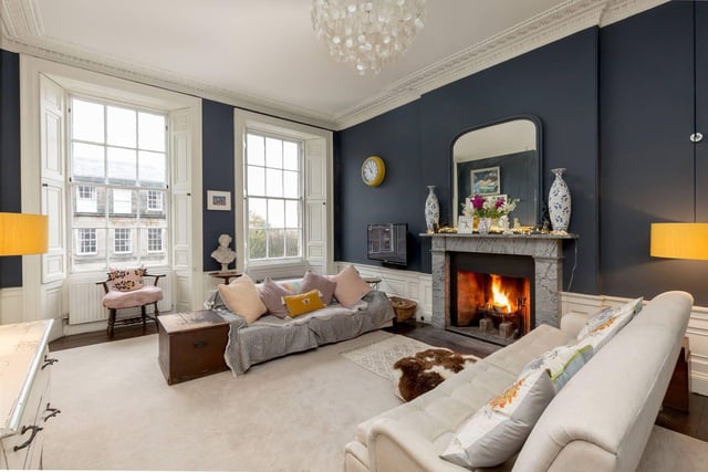To the front of the apartment is the elegant twin-windowed sitting room with the fireplace as its centrepiece.