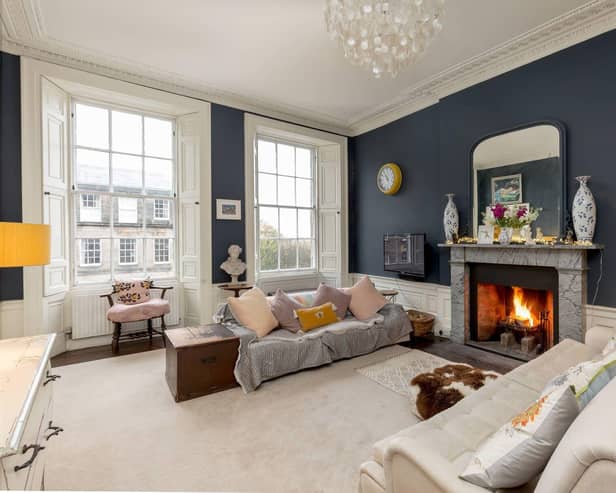 To the front of the apartment is the elegant twin-windowed sitting room with the fireplace as its centrepiece.