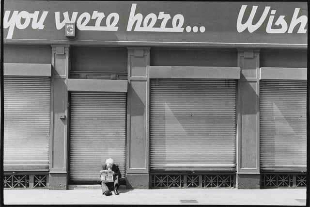 Iain Mackenzie's image of a man reading a newspaper in Glasgow in 1975 will feature in the exhibition You Are Here.