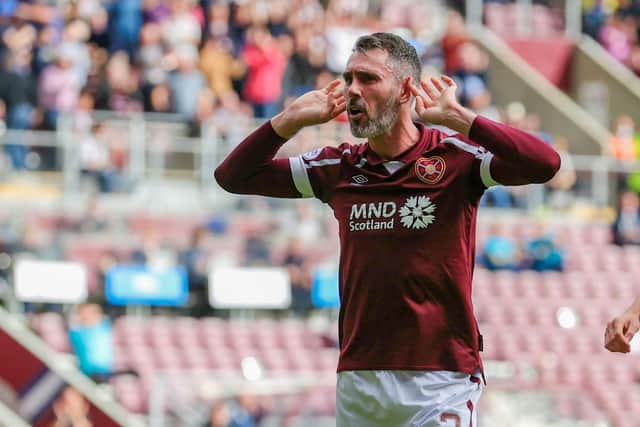 Michael Smith has signed a new deal with Hearts.