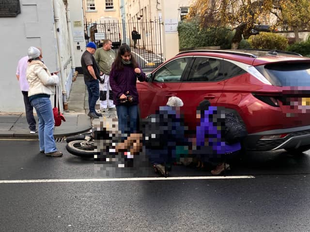 A cyclist was hit by a car on Canongate in Edinburgh
