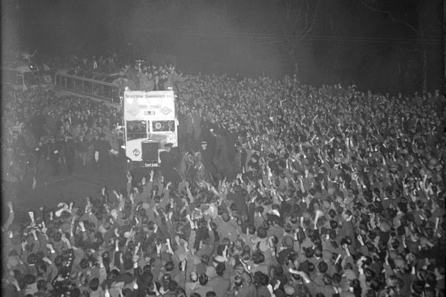 Crowds in Princes Street welcome the Scottish Cup to Edinburgh in 1956 after Hearts beat Celtic in the final. The Hearts team are on top of the open topped bus.