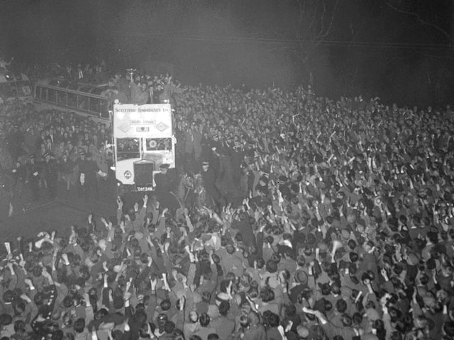 Crowds in Princes Street welcome the Scottish Cup to Edinburgh in 1956 after Hearts beat Celtic in the final. The Hearts team are on top of the open topped bus.